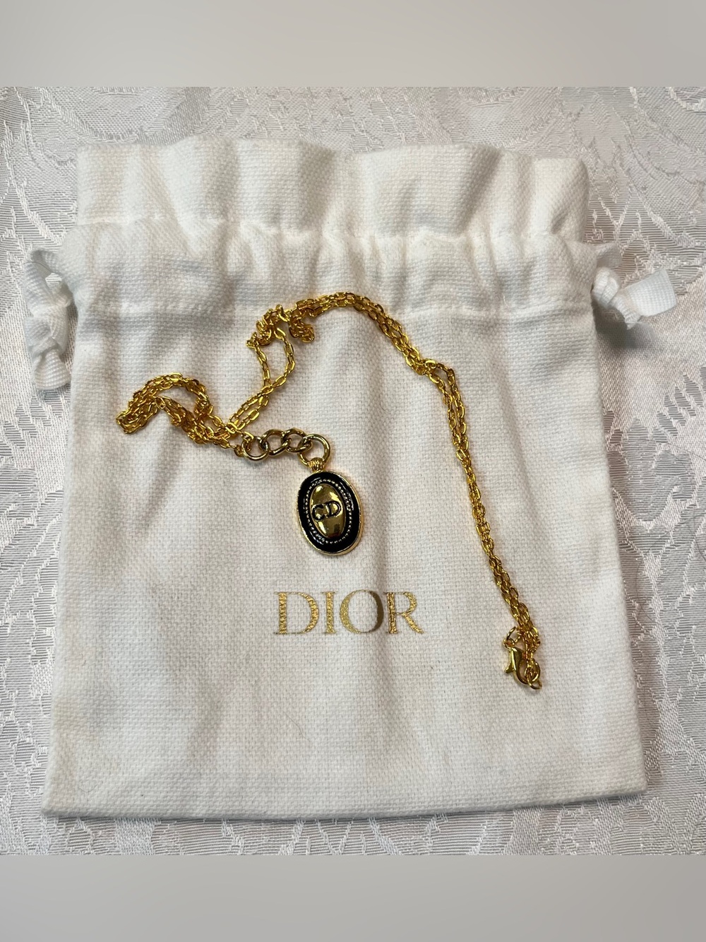 Dior Oval Pendant with Gold Tone Chain Necklace and Dior Pouch